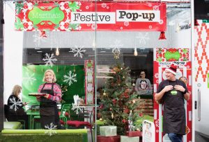 Martha's Festive Pop Up on Byres Road in Glasgow's West End. Pictured L to r Katie Talbot (front of house) in the window , Shannon Easter operations manager at the till and founder Gavin Clark outside. Photograph by Martin Shields Tel 07572 457000 www.martinshields.com © Martin Shields